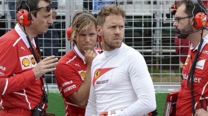 Sebastian Vettel kassiert nach seinem Manöver gegen Hamilton weitere Strafpunkte. Foto: Paul Chiasson