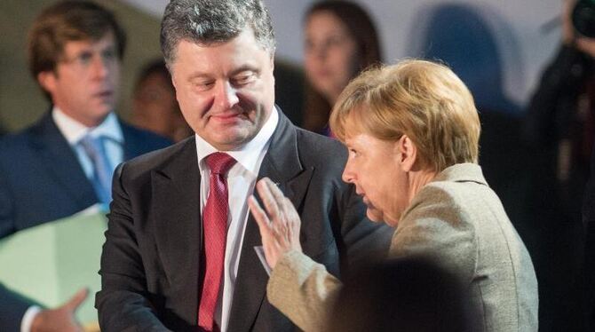 Der ukrainische Präsident Poroschenko und Bundeskanzlerin Merkel bei einem Treffen im September dieses Jahres. Foto: Maurizio