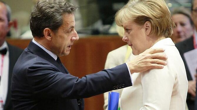 Frankreichs Präsident Sarkozy  und Kanzlerin Merkel beim jüngsten Gipfel der Staats- und Regierungschefs in Brüssel (Foto vom