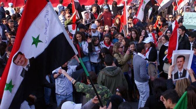 Solidarität mit ihrem Präsidenten: Pro-Assad Anhänger auf einer Demonstration in Damaskus. Foto: Sana 