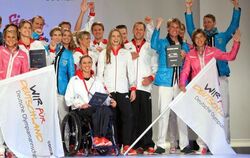 Sportler präsentieren die Kollektion für die deutsche Olympia-Mannschaft. Foto: Bernd Thissen