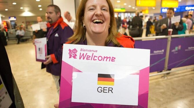 Meet and greet Teams begrüßen Besucher der Olympischen Spiele.