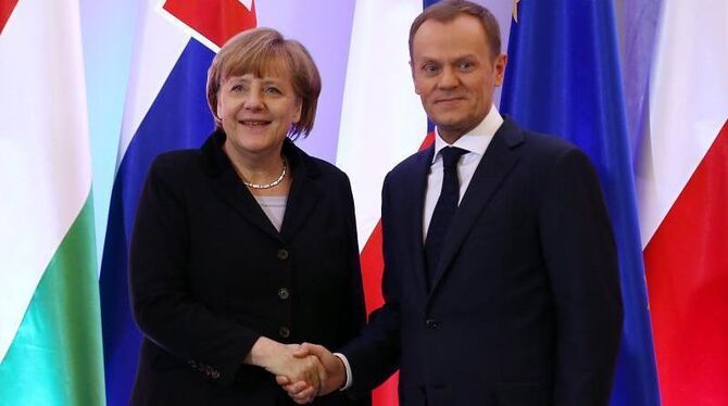 Bundeskanzlerin Angela Merkel und Polens Ministerpräsident Donald Tusk. Foto: Tomasz Gzell/Archiv