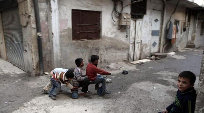 Kinder spielen während der Waffenruhe in den Straßen Damaskus. Foto: Mohammed Badra