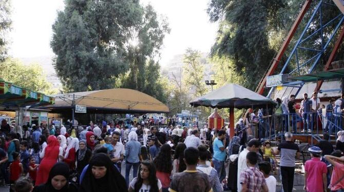 Opferfest in einem Freizeitpark in Damaskus: Die Waffenruhe in Syrien hält derzeit. Foto: Youssef Badawi